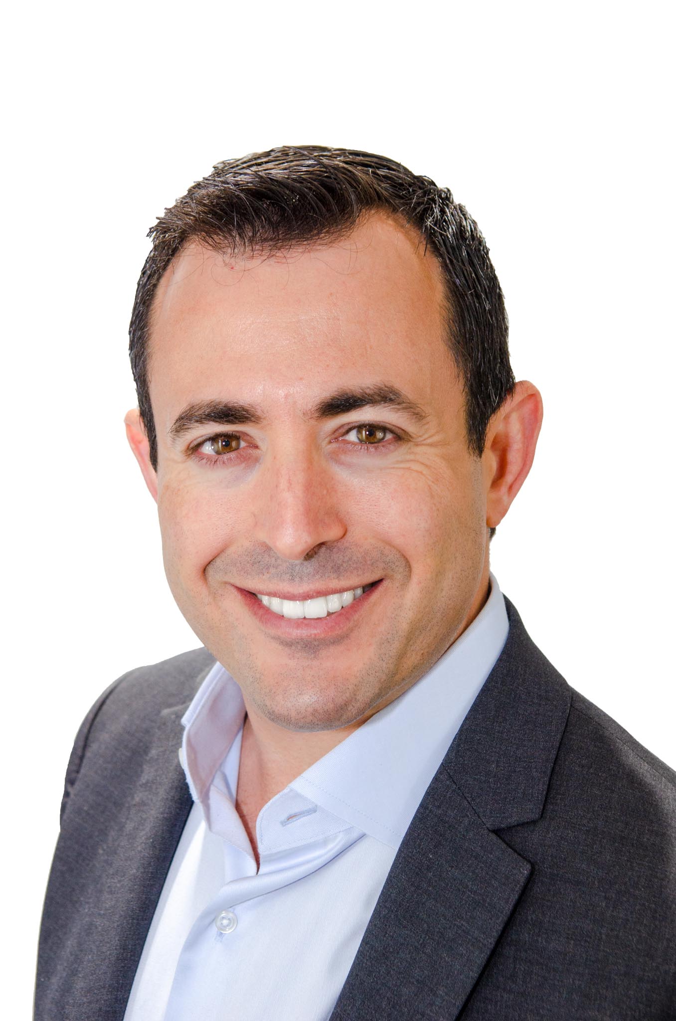 Smiling man in a dark jacket against a white backdrop